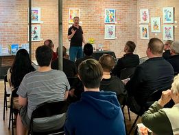 Guests listening to Dave Hughes speak about Maybe Next Year and Instant Adult