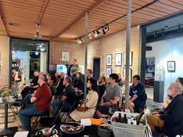 Guests listening to Dave Hughes speak about Maybe Next Year and Instant Adult